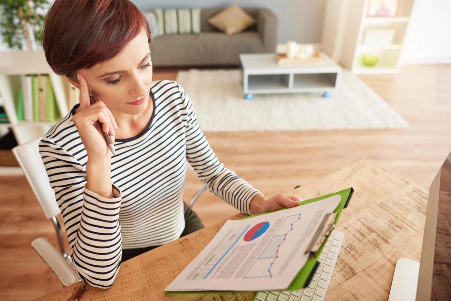 woman-thinking-about-some-important-documents